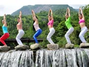 Yoga performed around waterfall in Jiangxi