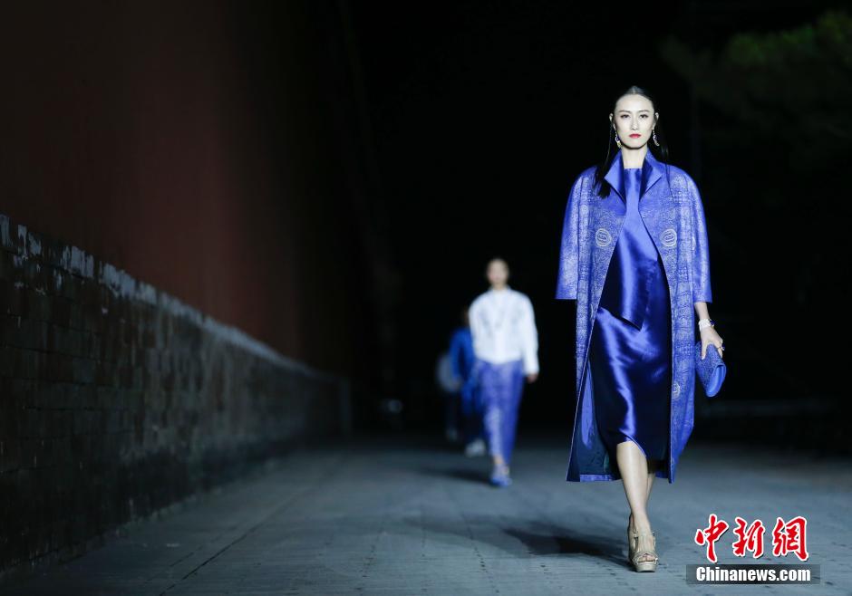 Fashion show staged in Forbidden City at night