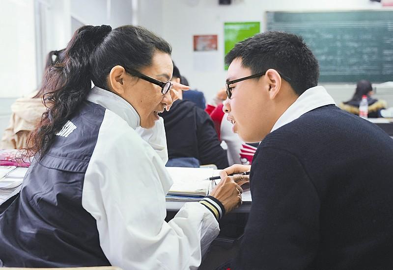 Mother demonstrates love for autistic son by becoming his 'classmate'