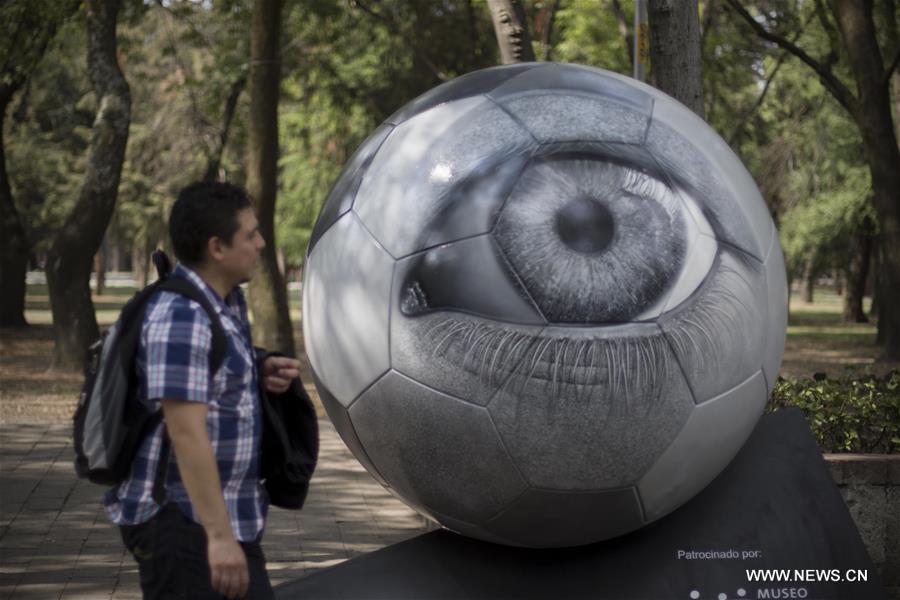 64 sculptures in shape of soccer ball exhibited in Mexico