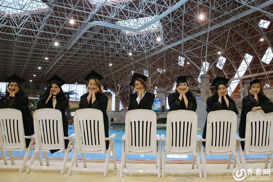 Students take stylish bikini graduations photos