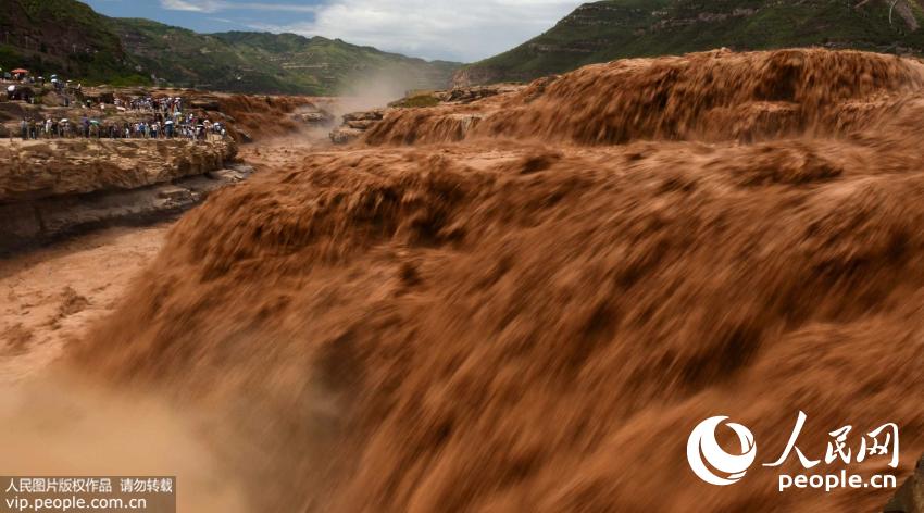 Spectacular Hukou Waterfall during summer flood season