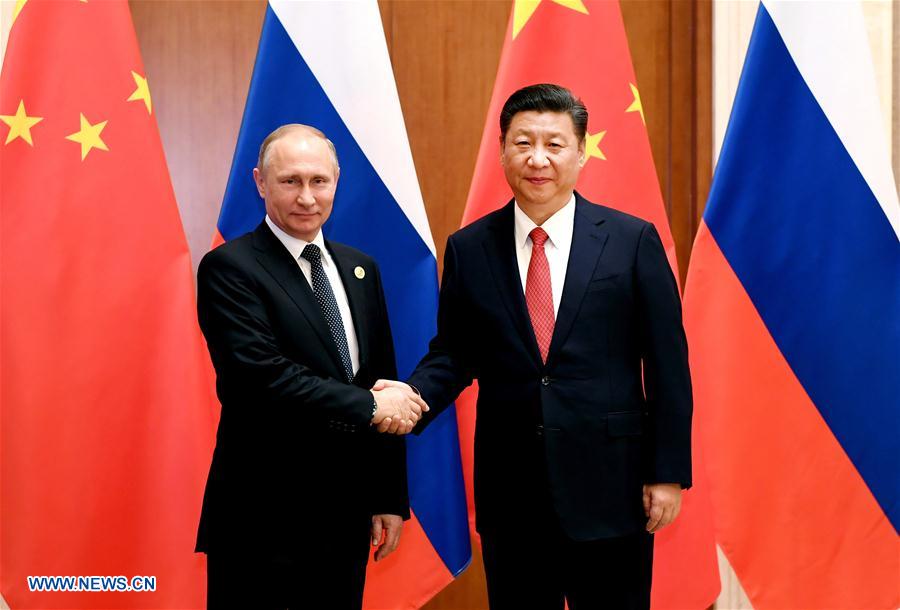 Chinese President Xi Jinping (R) meets with Russian President Vladimir Putin, who is here for the Belt and Road Forum (BRF) for International Cooperation, at the Diaoyutai State Guesthouse in Beijing, capital of China, May 14, 2017. (Xinhua/Rao Aimin)