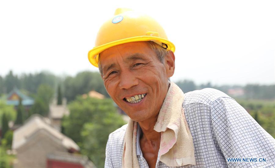 Outdoor work continues despite sweltering weather across many parts of China