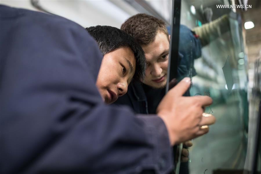 Workers busy at Russian factory of China's Fuyao Glass in Kaluga