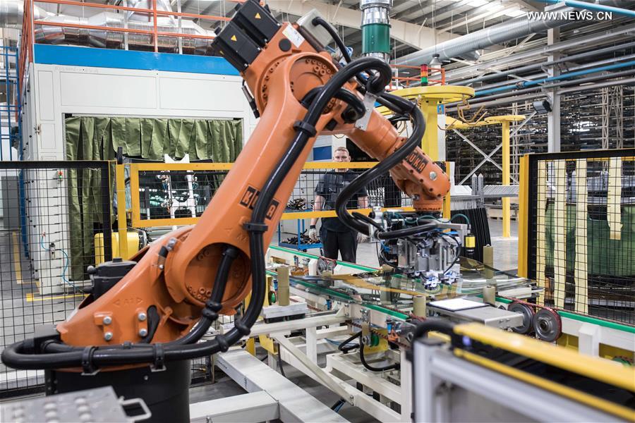 Workers busy at Russian factory of China's Fuyao Glass in Kaluga