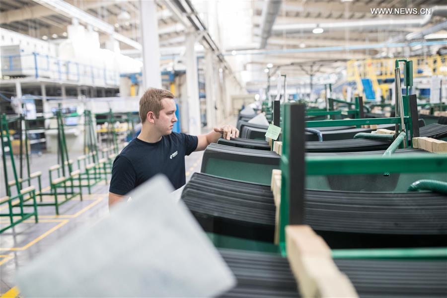 Workers busy at Russian factory of China's Fuyao Glass in Kaluga