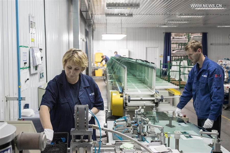 Workers busy at Russian factory of China's Fuyao Glass in Kaluga