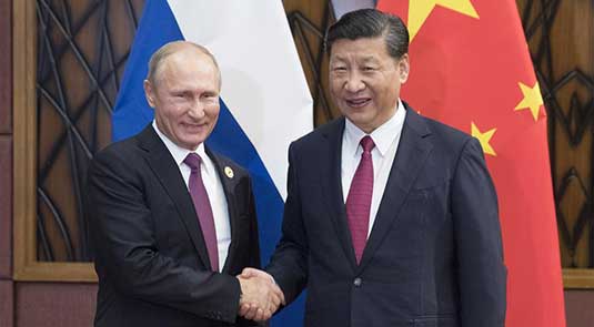 Xi, Putin pledge to enhance regional, int'l cooperation