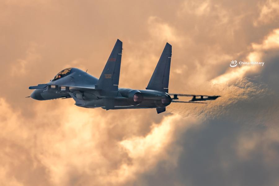 J-11B fighter jet flies past the sun