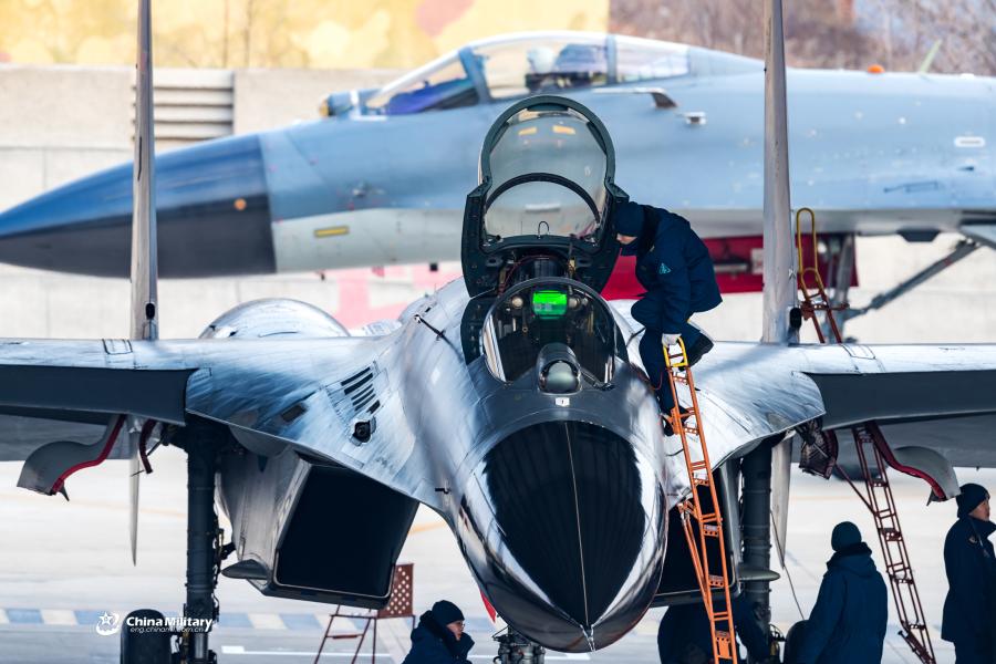 J-11B fighter jet flies past the sun