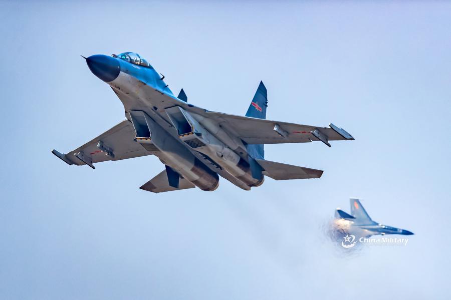 J-11B fighter jet flies past the sun
