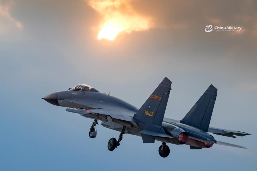 J-11B fighter jet flies past the sun