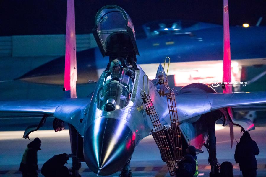J-11B fighter jet flies past the sun