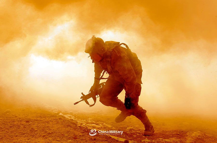 A scout runs through mock enemies' blockade