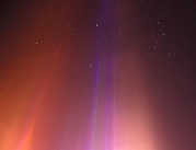 Light beam-sword cuts through night in cold northwestern village