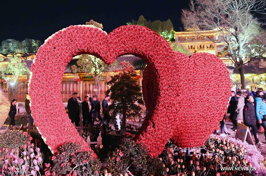 Tourists visit Lijiang ancient town in southwest China's Yunnan