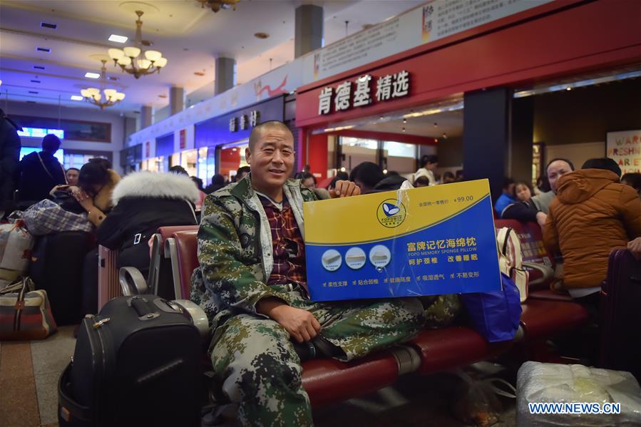 Passengers bring gifts for families as they head home for Spring Festival