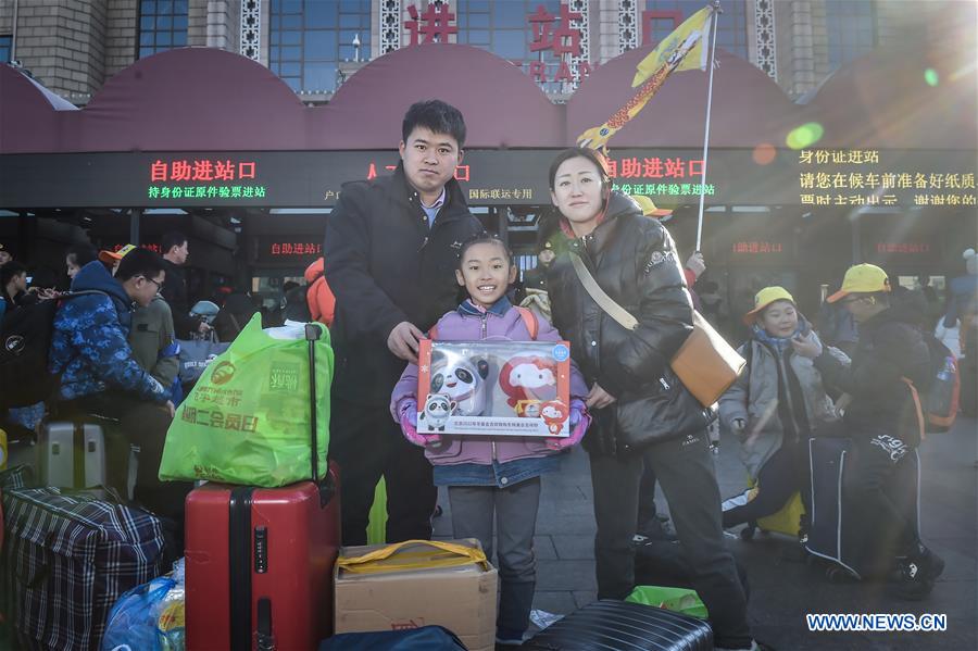 Passengers bring gifts for families as they head home for Spring Festival