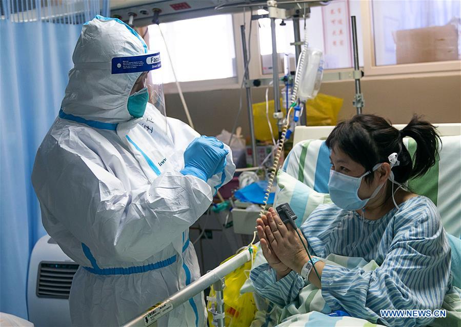 Medical workers take care of patients in Wuhan