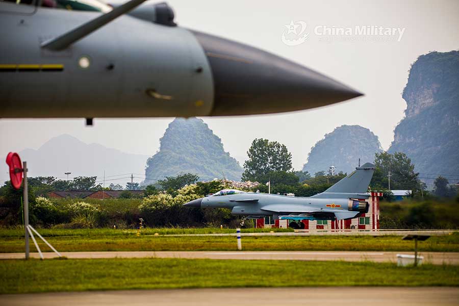 Fighter jets head for take-off on taxiway before flight