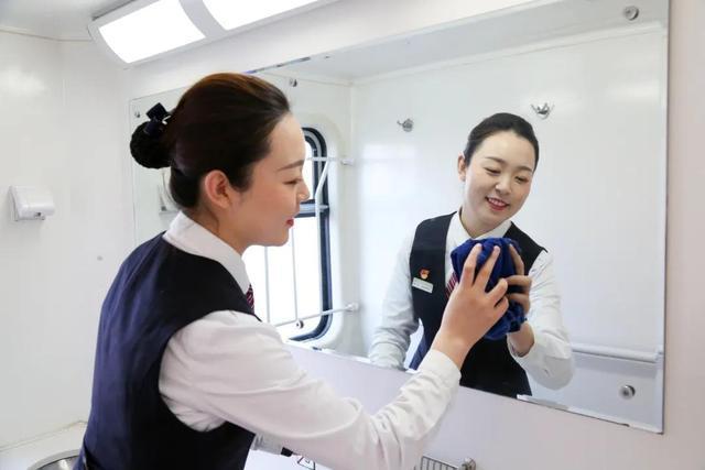 Attendants change uniforms six times as train moves southward