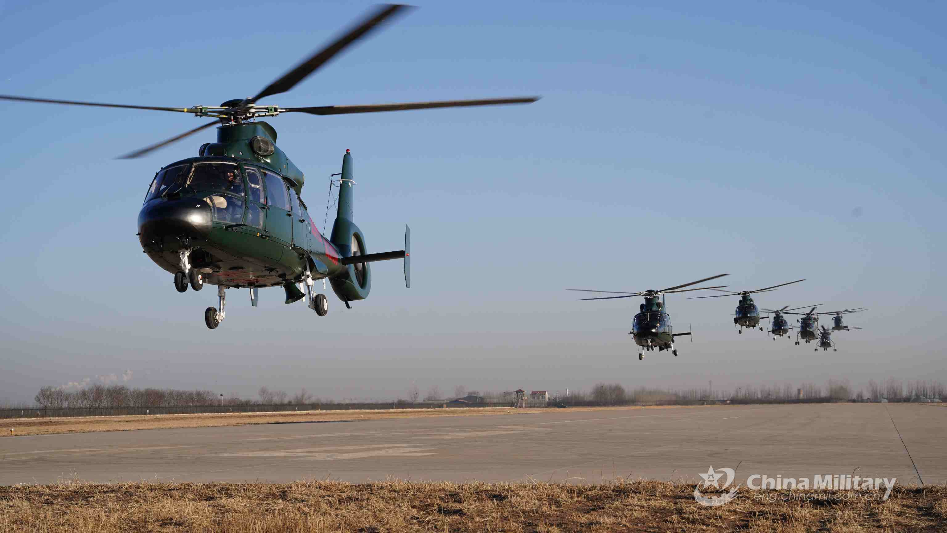 PAP service members manipulate attack helicopters in flight mission