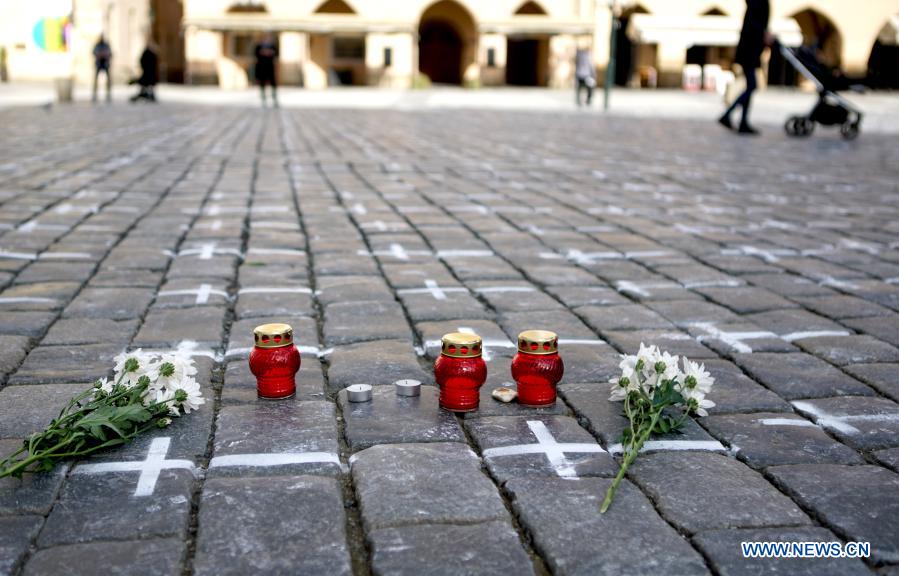 Old Town Square painted with white crosses in memory of victims of COVID-19 pandemic in Prague