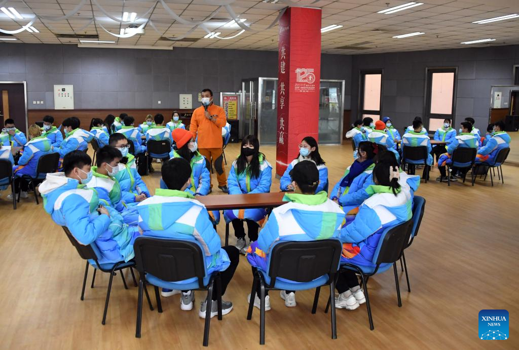 Volunteers for Beijing Olympics attend training session to develop skills