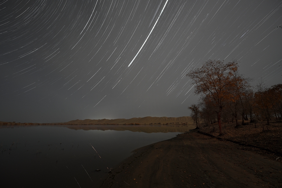 Brilliant starry sky over Luobu Lake in NW China's Xinjiang