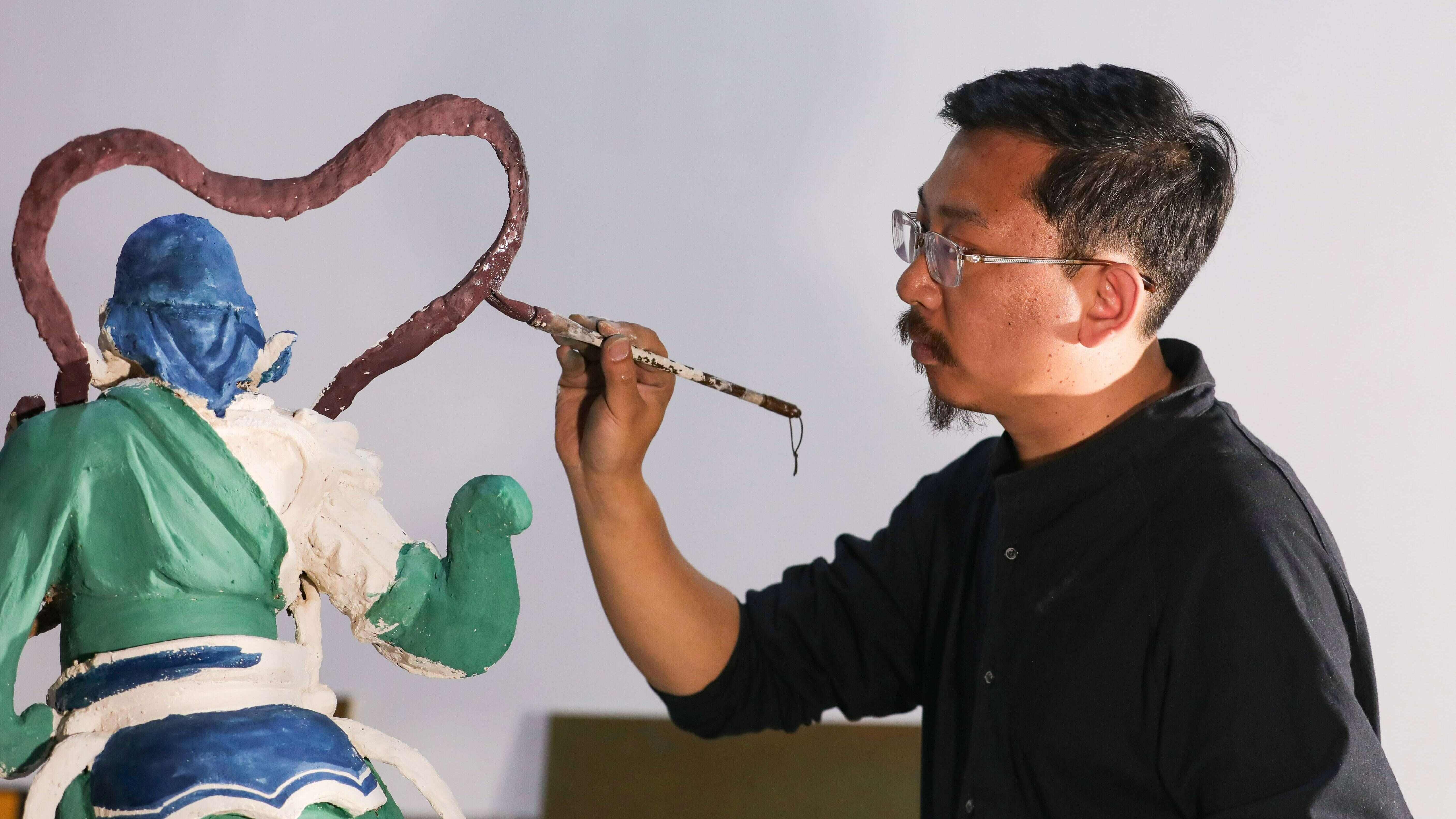Young Chinese artisan recreates ancient murals lost overseas a century ago