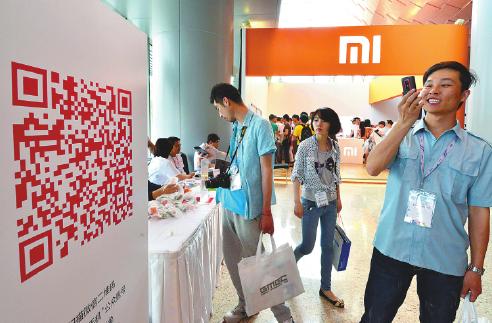 A Xiaomi Corp stand at the Global Mobile Internet Conference in Beijing in May. The Chinese smartphone maker is planning an expansion into overseas markets.[Photo/China Daily] 