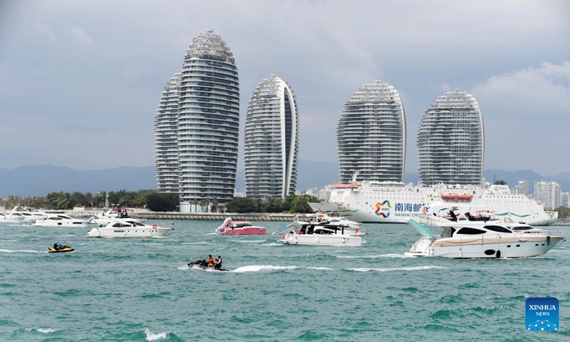 Tourists take yachts to have fun in Sanya, south China's Hainan Province, Feb. 13, 2025. The yacht tourism industry has recently seen a boom in Sanya of Hainan, with local maritime authorities implementing various measures to ensure safe travelling experiences of tourists on the sea. (Photo: Xinhua)