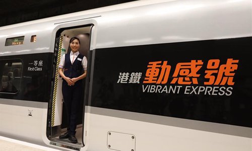 An attendant is seen on a train of the Guangzhou-Shenzhen-Hong Kong Express Rail Link (XRL), in Hong Kong, south China, Aug. 16, 2018. The trial run of the Hong Kong Section of XRL has been completed on Thursday. The 26-km Hong Kong section of the XRL links up Hong Kong with the mega high-speed rail network of the Chinese mainland. (Xinhua/Lui Siu Wai)