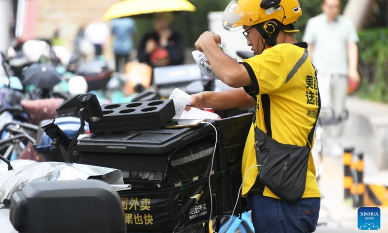 A delivery man works in Beijing, capital of China, June 11, 2024. (Photo: Xinhua)