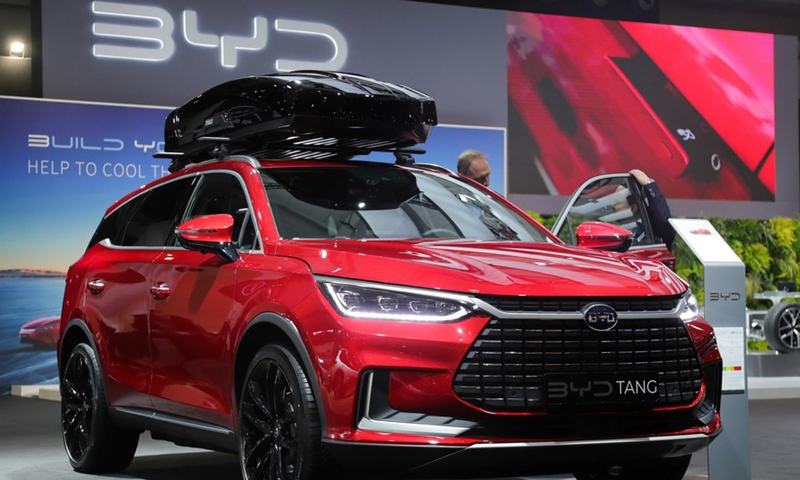 A man looks at a BYD Tang during the press day of the 100th Brussels Motor Show in Brussels, Belgium, January 13, 2023. Photo:Xinhua