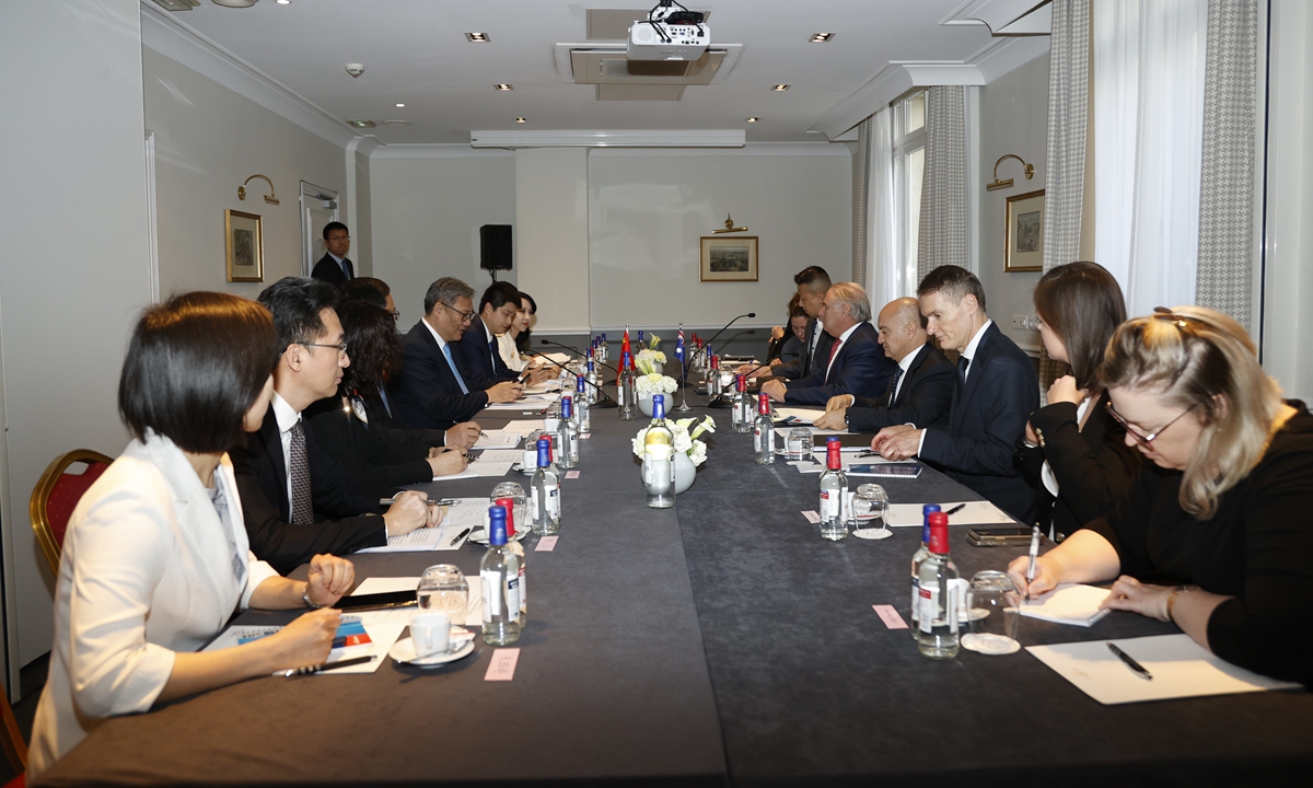 China's Commerce Minister Wang Wentao meets with Australia's Minister for Trade and Tourism Don Farrell on the sidelines of a WTO mini-ministerial meeting in Paris, France, on June 3, 2025. Photo: Courtesy of MOFCOM