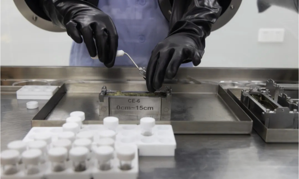 A researcher handles the Chang’e-6 lunar samples in a laboratory on September 24, 2024. Photo: Xinhua
