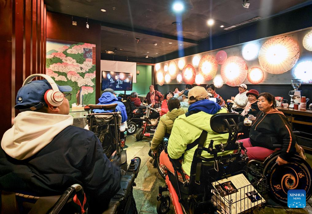 Restaurant in Beijing holds accessible film screening for visually impaired people