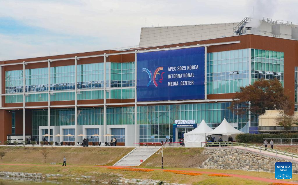 Journalists work at media center as APEC Economic Leaders' Meeting kicks off in South Korea
