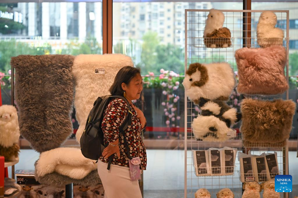 People select products at CIIE Bazaar City Arena in Shanghai