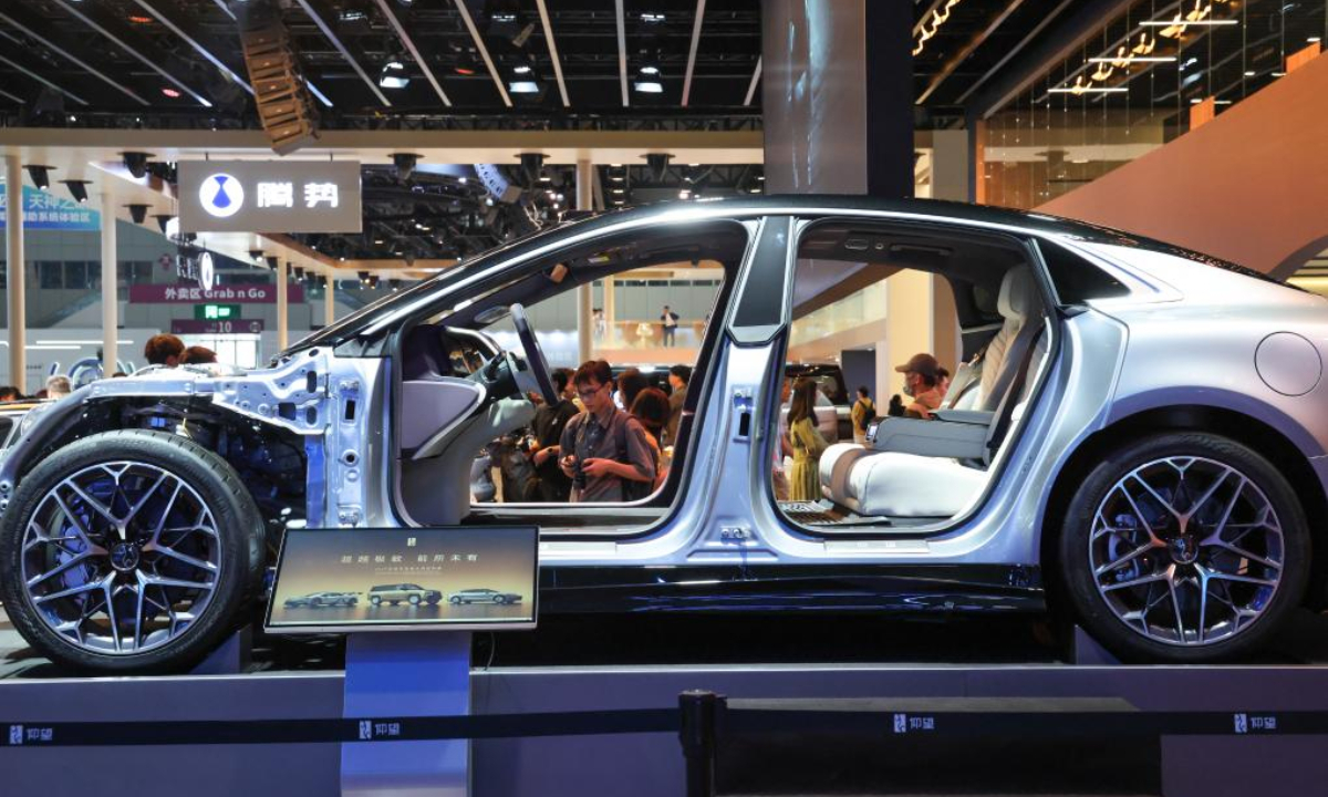 Visitors look at vehicles at the booth of BYD during the 2025 Guangdong-Hong Kong-Macao Greater Bay Area International Auto Show in Shenzhen, south China's Guangdong Province, May 31, 2025. (Xinhua/Liang Xu)